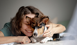 Woman hugging her dog